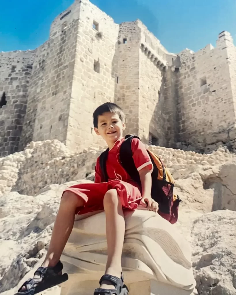 J Quincy Harvey as a young boy in front of a castle