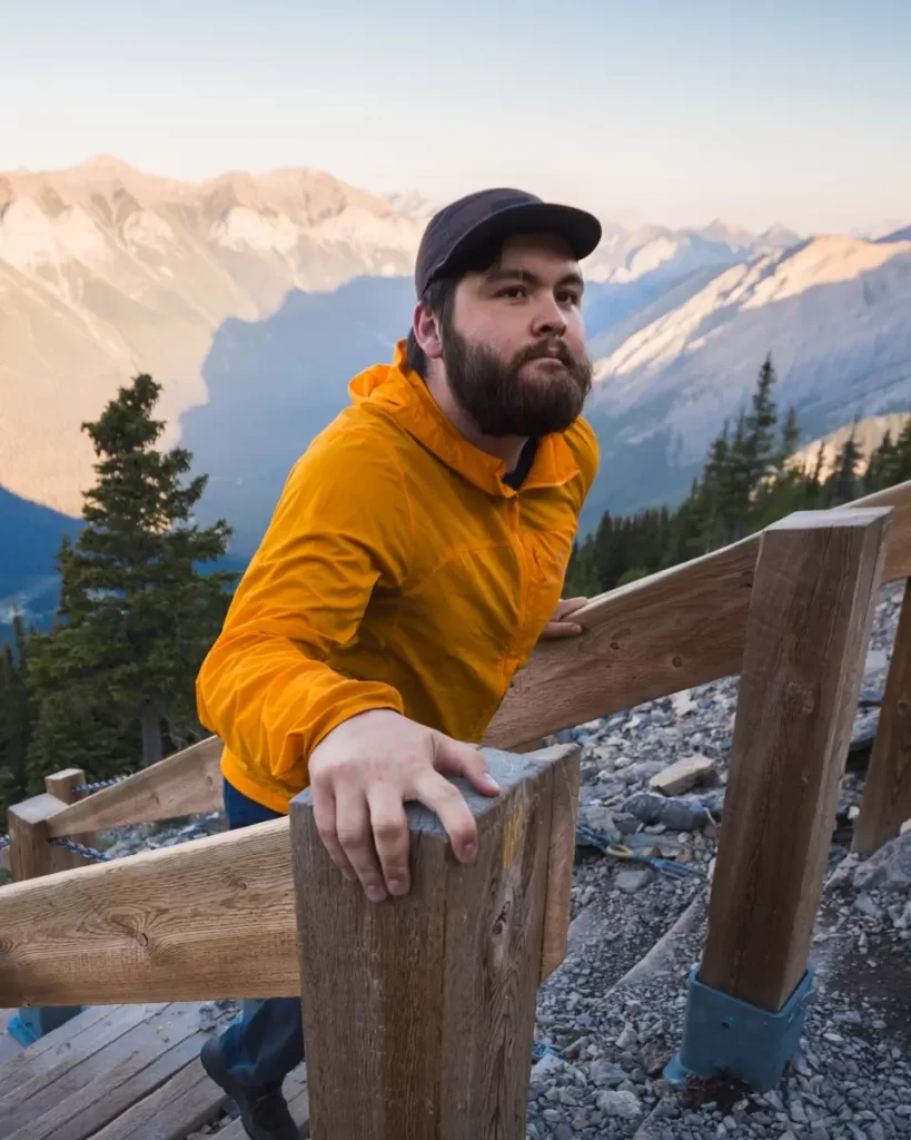 J Quincy Harvey hiking up a mountain